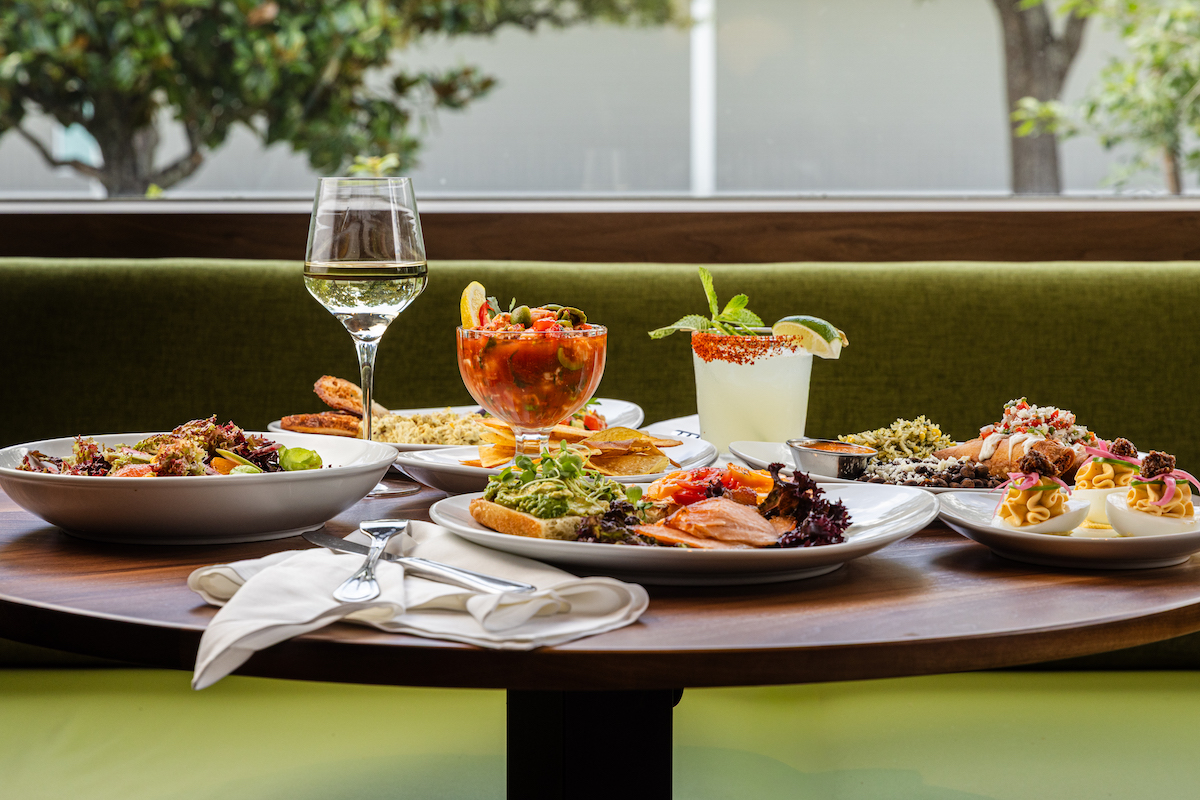 Chroma-Jun26-63 - DiningOut A selection of chrôma's globally inspired dishes includes salads, seafood, shareable plates, cocktails, and desserts, reflecting chef Claire Smith's all-day menu. | Photo by Becca Wright