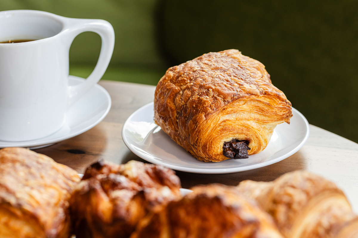 Chroma-Jun26-85 - DiningOut Morning service at chrôma begins with Cruiser coffee and freshly baked pastries, including buttery pain au chocolat. | Photo by Becca Wright