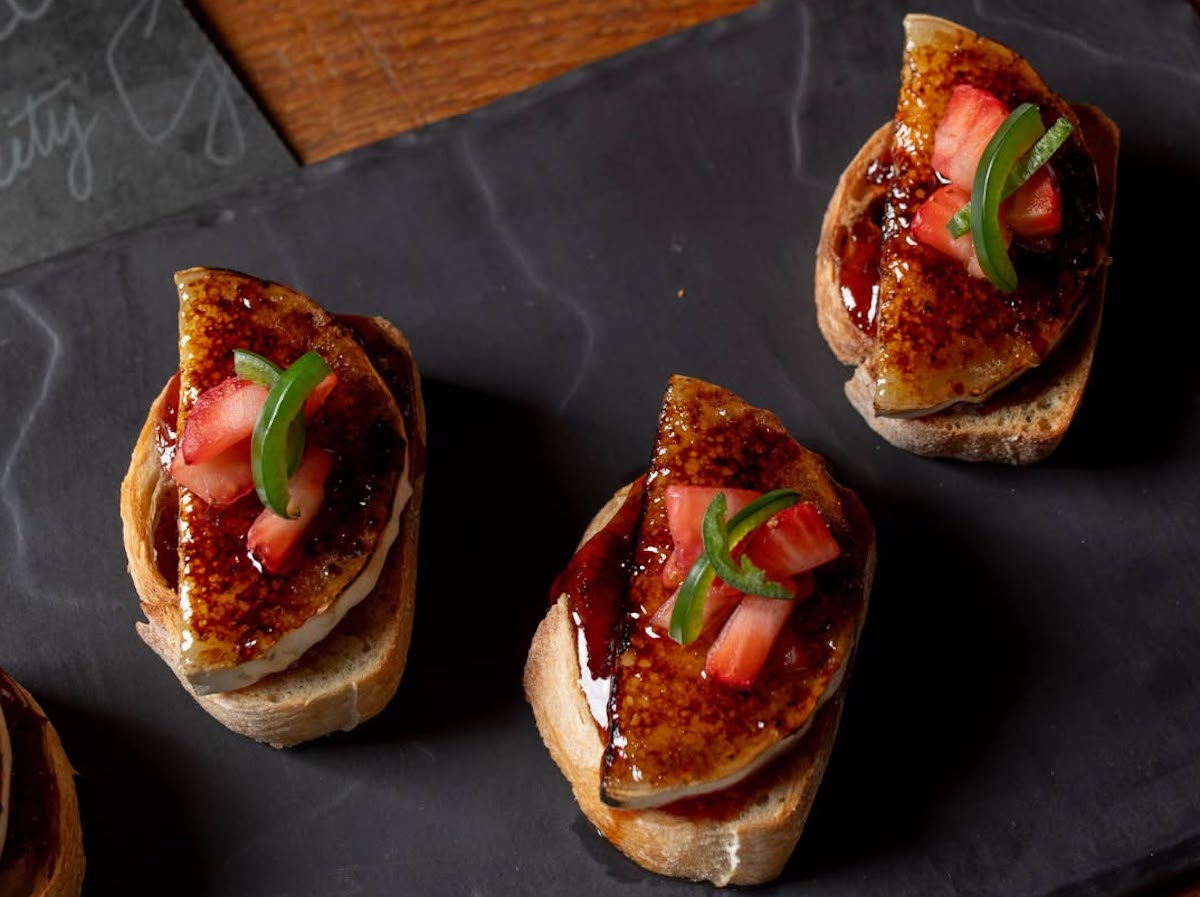 Basque-inspired pintxos, including foie gras on toasted bread, showcase the inventive small plates at Cooks & Soldiers. Photo by Cooks & Soldiers