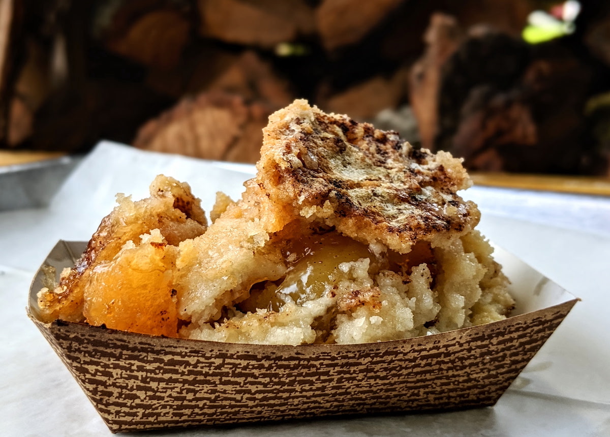 CorkScrew BBQ's signature fruit cobbler features warm, bubbling fruit beneath a crisp, cookie-like topping—a sweet finale worthy of the Michelin-starred smokehouse. |
Photo by CorkScrew BBQ
