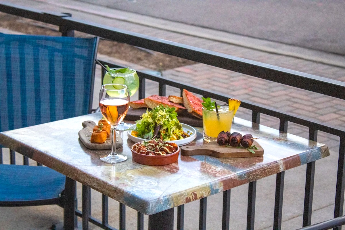 DEN_9th_door - DiningOut Sit outside and share some bites with friends. | Photo courtesy of 9th Door