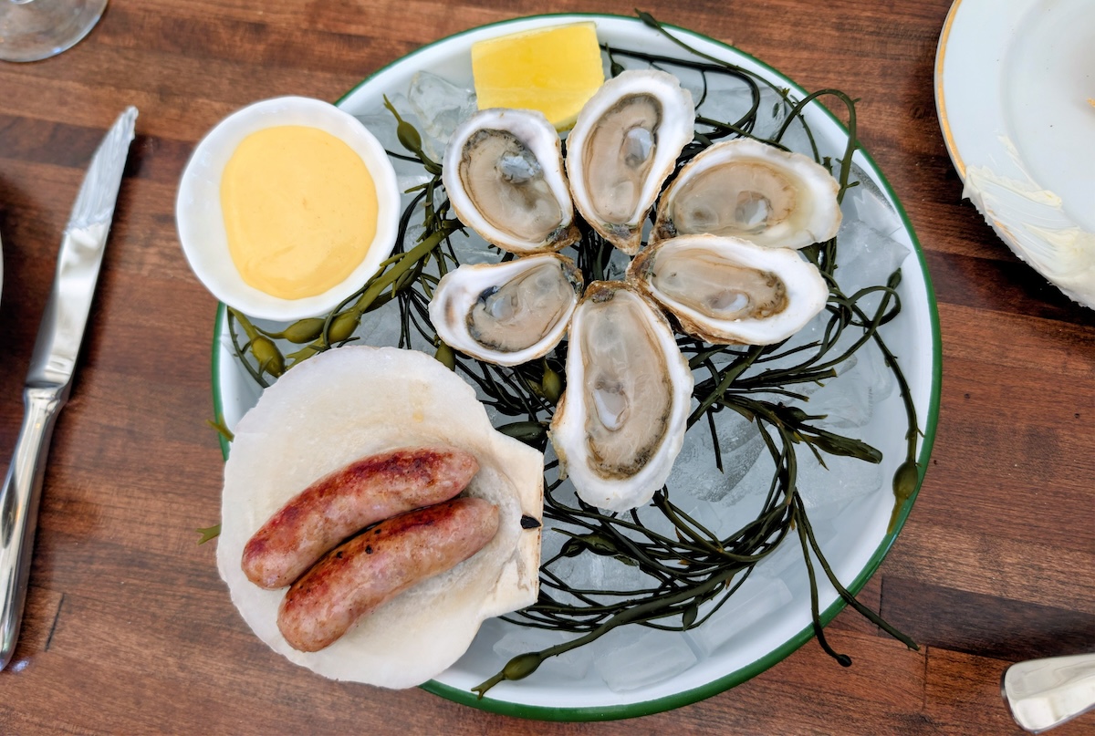 The oysters of the day, served with chipolata sausage and a dijon sauce. | Photo by Linnea Covington