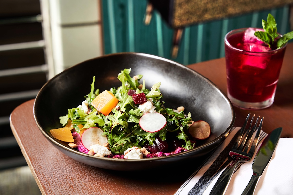 The Beet Salad features local goat cheese and beet-sunflower pesto. | Photo by Werk Creative