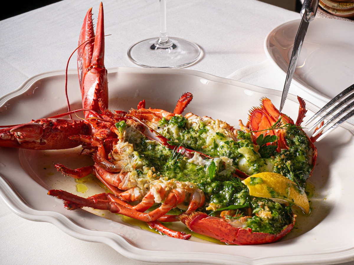 St. Cecilia - DiningOut A whole lobster dressed with bright herbs and citrus, one of the indulgent seafood offerings at Ford Fry's St. Cecilia. | Photo by St. Cecilia