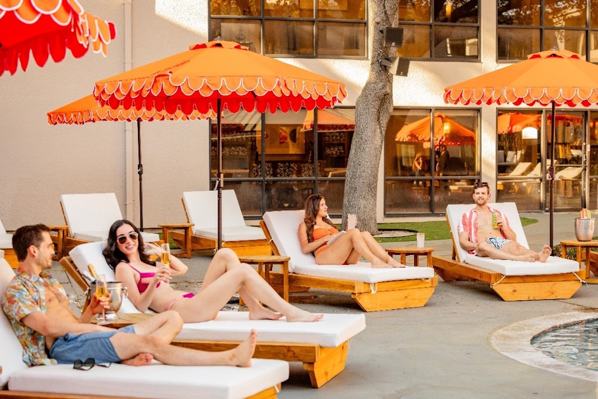 Waterloom Pool Lounge at Hotel Dax brings laid-back summer vibes to Addison with poolside loungers, frozen cocktails, and oversized outdoor screens. | Photo by Hotel Dax