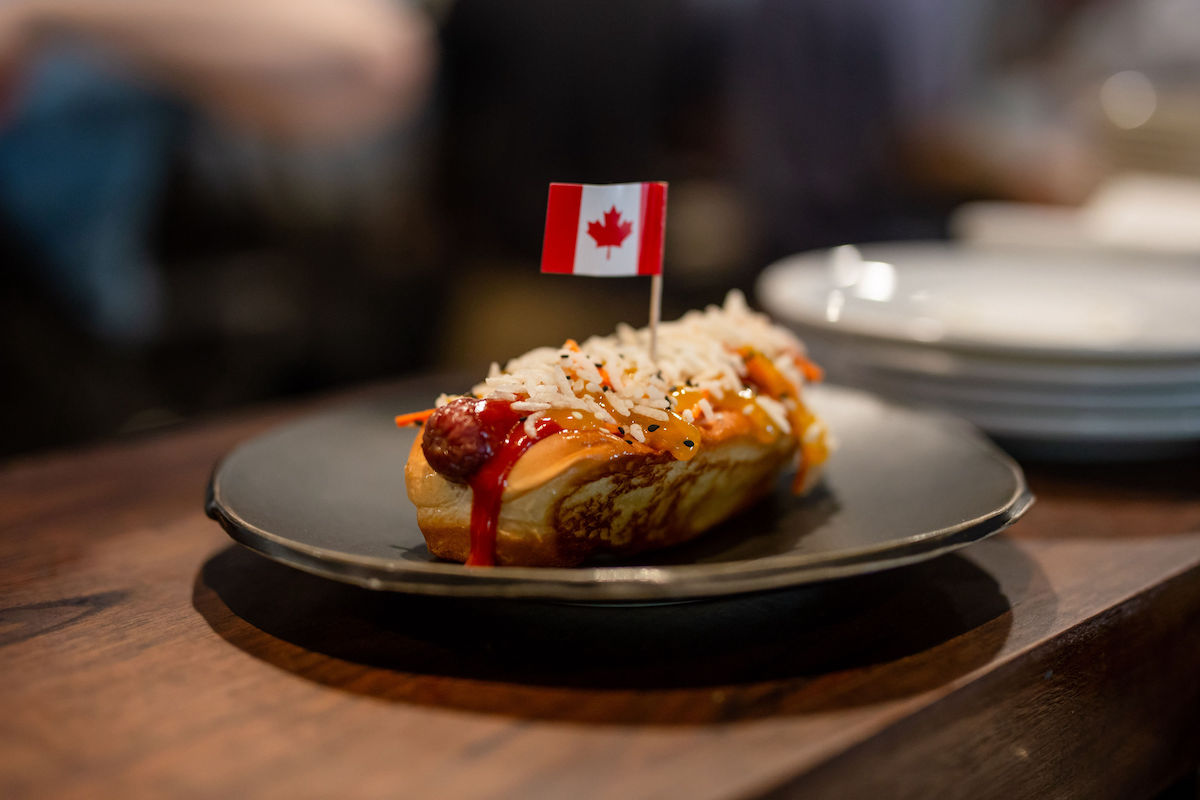 The Deli Dog, one of Riel’s most memorable menu items, returns as part of the one-day Booze Can Sunday revival at Chardon. | Photo by Kirsten Gilliam
