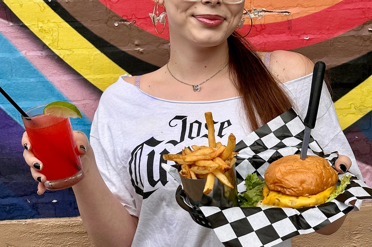 Den_Hamburger Marys Denver_burger_person - DiningOut Pride month specials await. | Photo by Hamburger Mary's Denver