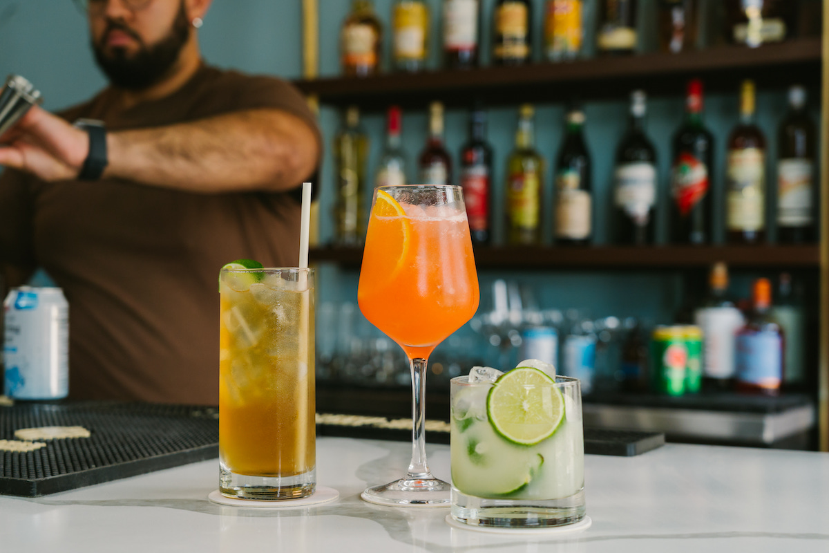 Yuma's beverage program includes cocktails and zero-proof drinks inspired by Brazilian and Cuban flavors, including the Guarana Libre, Guava Aperol Spritz, and Guanabana Caipi. | Photo by Rebekah Flores