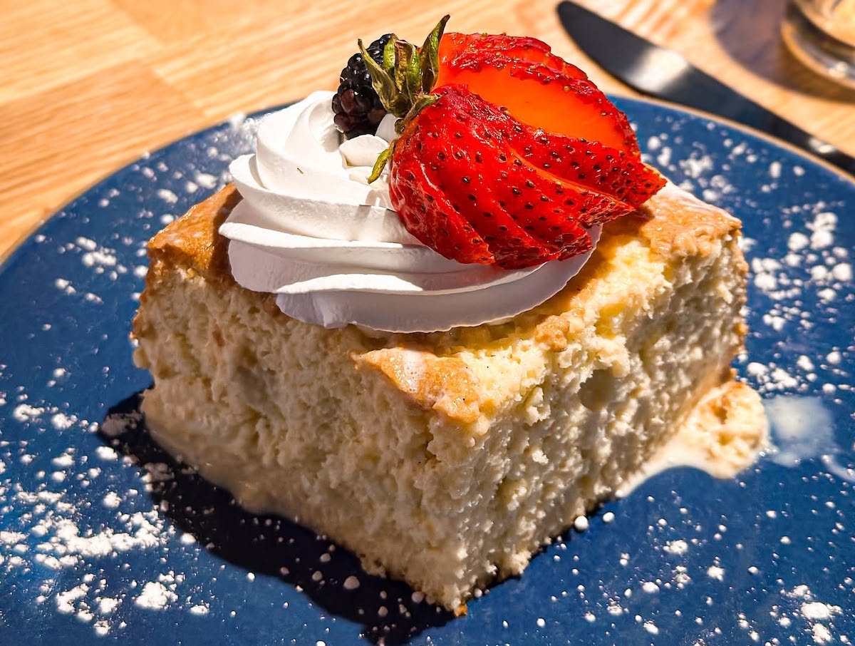 Killen’s signature bread pudding, rich with custard and topped with whipped cream and fresh berries, remains one of the Houston area’s most beloved barbecue desserts. | Photo by Killen's BBQ
