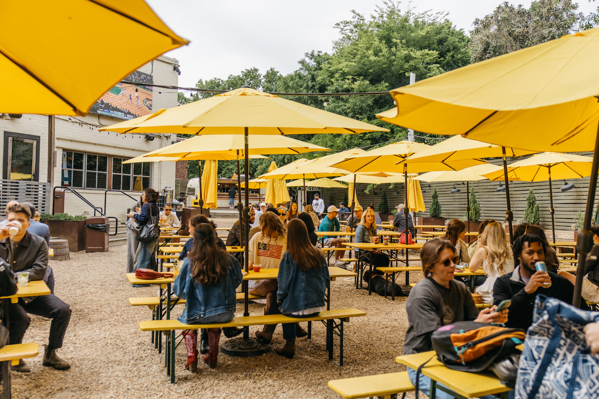 Lady Bird Grove Mess Hall Patio credit Luke Beard - Electric Hospitality Is groovy - DiningOut Ladybird’s expansive Eastside Trail patio has been a favorite post-walk gathering spot for Atlanta dog owners since opening directly on the BeltLine. | Photo by Luke Beard Electric Hospitality is Groovy