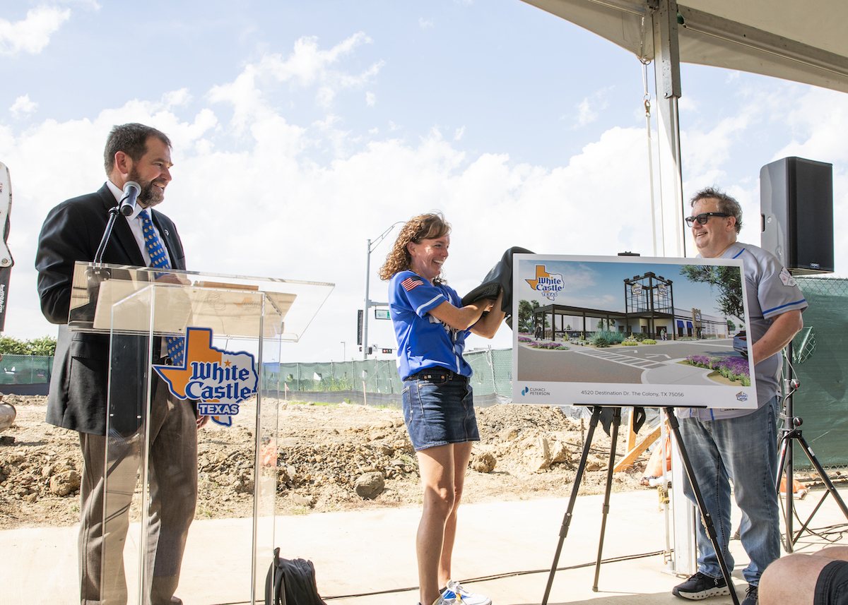 White Castle leaders unveil a rendering of the company's first Texas restaurant during a groundbreaking ceremony at Grandscape in The Colony. | Photo by White Castle Texas