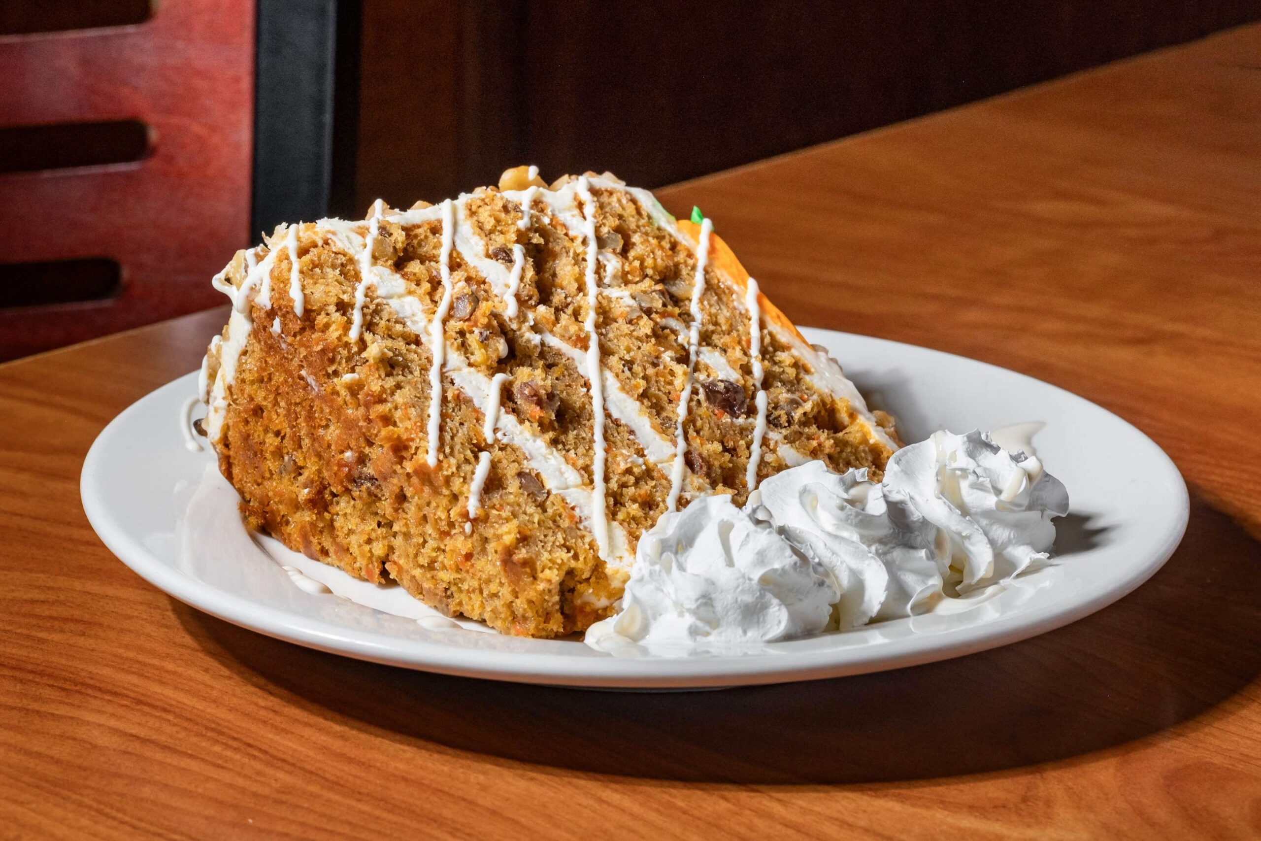 Marietta Diner Carrot Cake - DiningOut Marietta Diner’s towering slices of carrot cake are nearly as famous as the diner itself, drawing dessert lovers at all hours of the day and night. | Photo by Marietta Diner