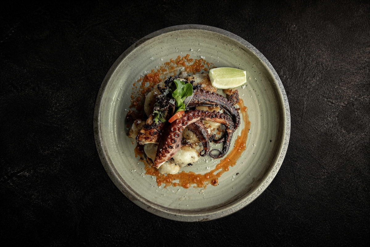 The Pulpo y Papas Smashed. | Photo courtesy of Bueno Restaurant & Bar 