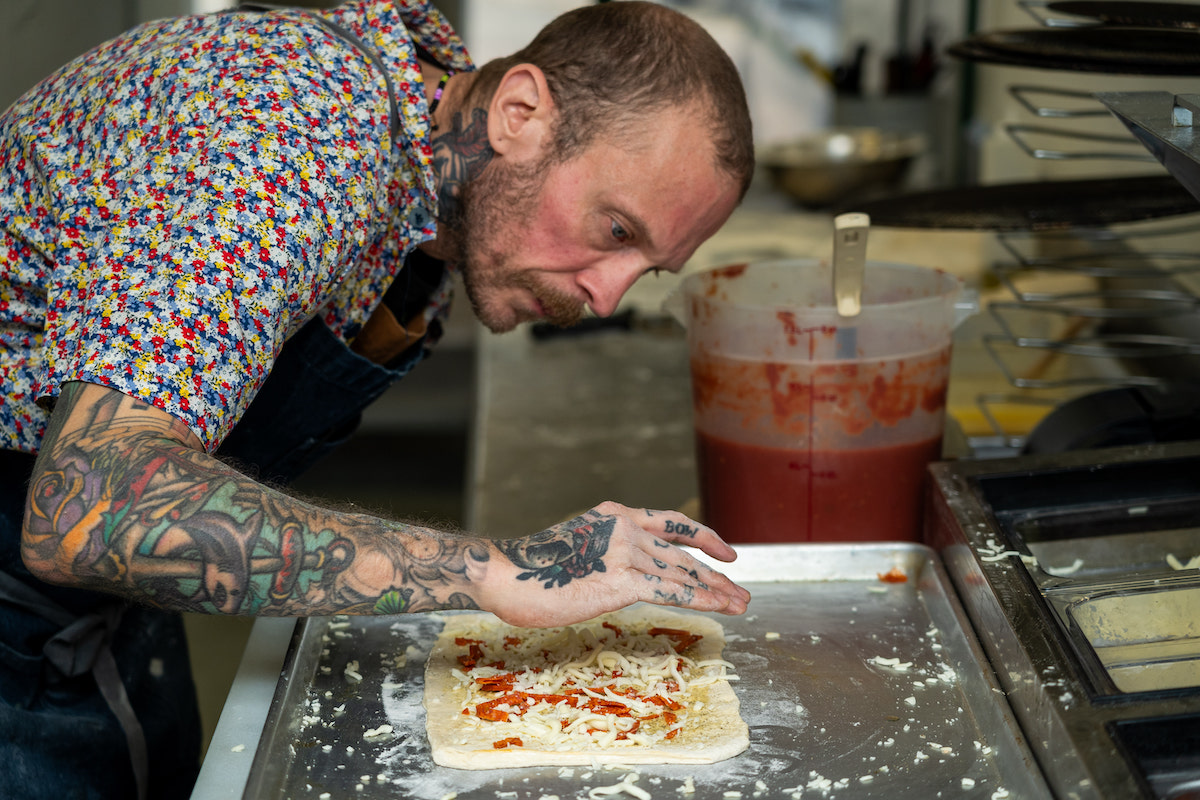 Galaxy Pizza founder Anthony Calleo prepares one of the restaurant's specialty pies. | Photo by Rebekah Flores