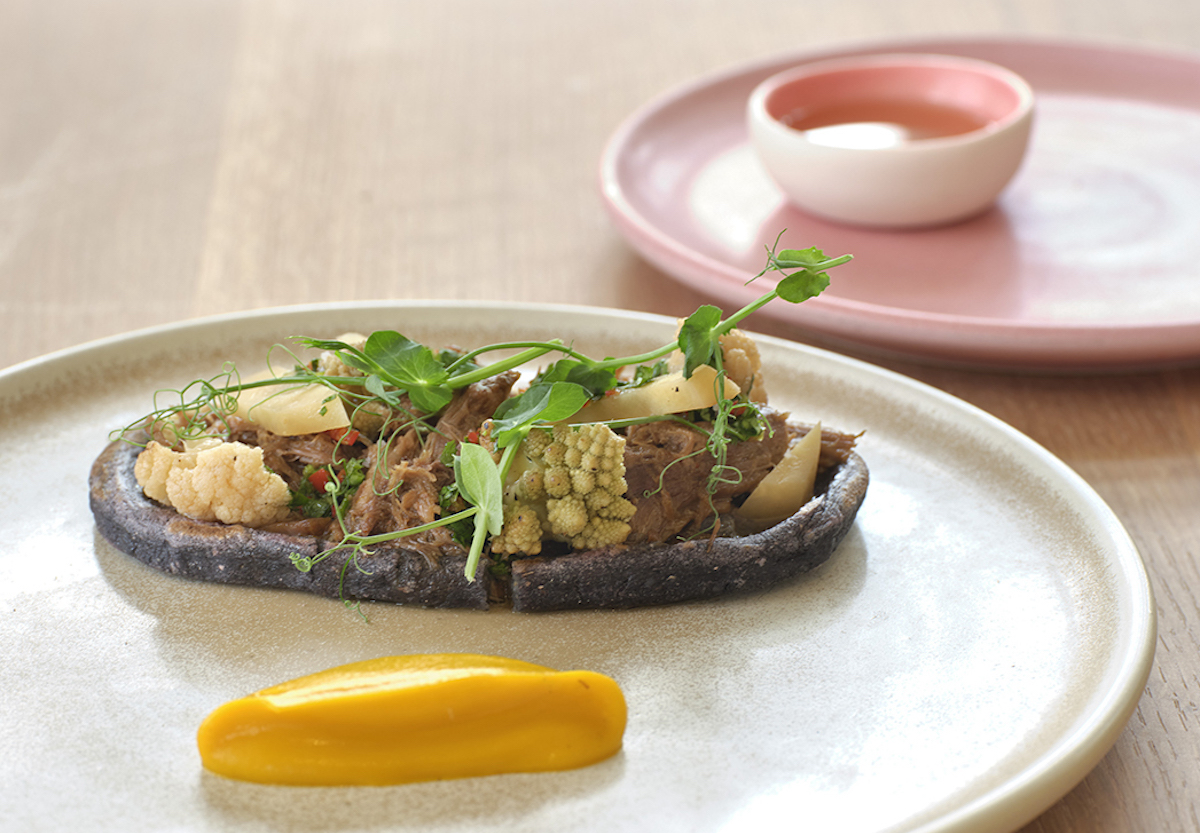 Oloyo_Huarache_PhotobtElizabeth Lavin - DiningOut The Huarache at Olōyō features slow-simmered Campra Foods lamb barbacoa served atop house-made heirloom corn masa with seasonal vegetables. | Photo by Elizabeth Lavin