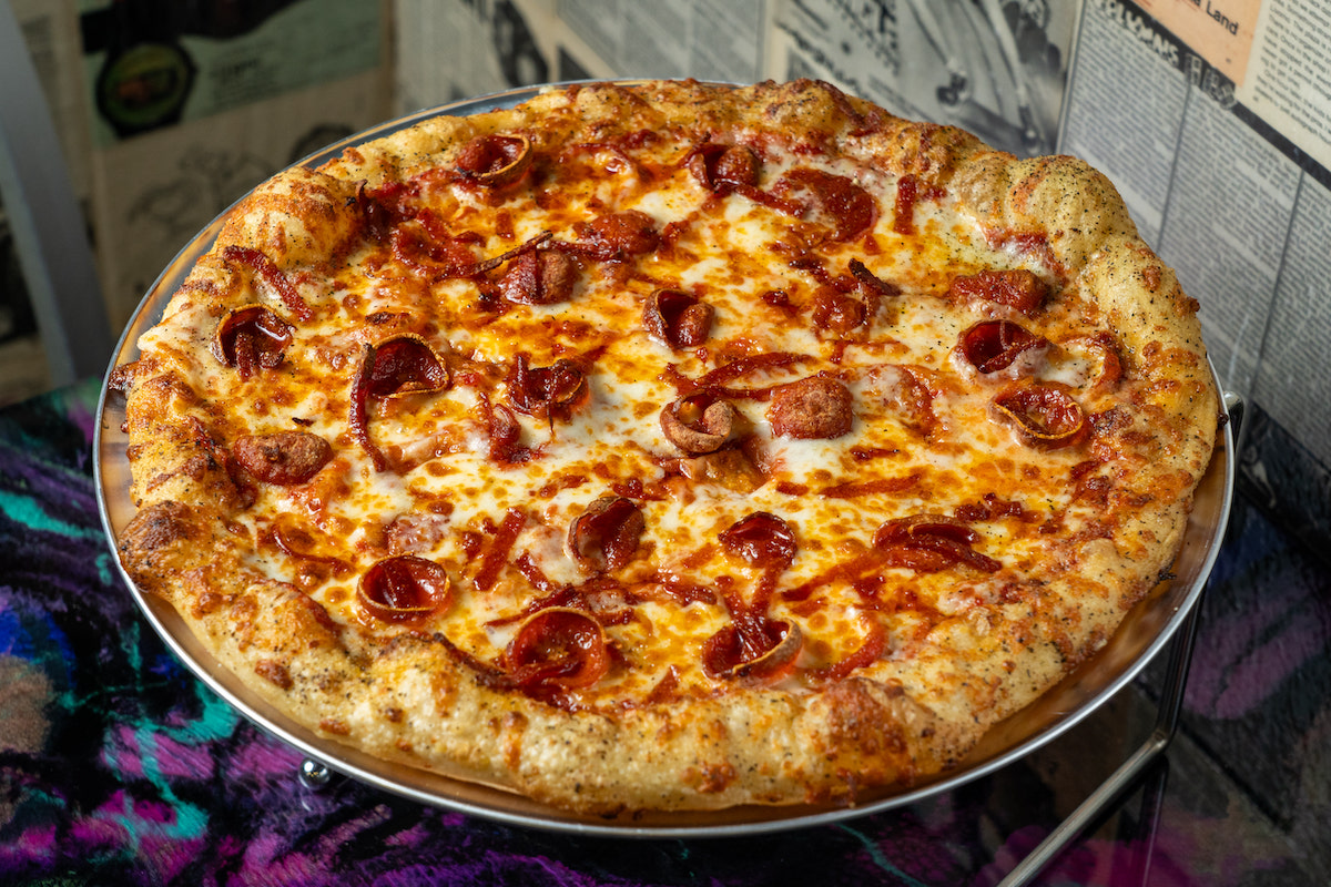 The Pepperonius Maximus, one of Galaxy Pizza's signature pies, is topped with three varieties of pepperoni and extra cheese atop the restaurant's four-day-aged hybrid dough crust. | Photo by Rebekah Flores