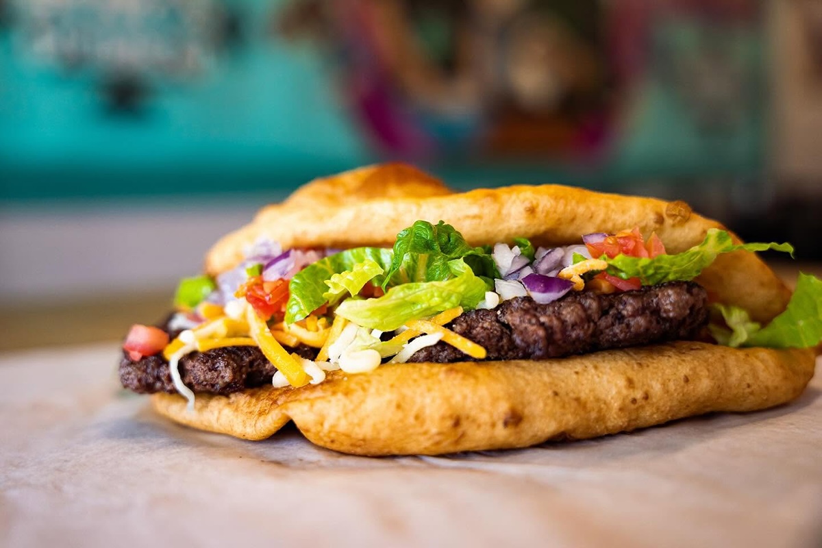 The Navajo Burger includes smash-style beef patties hugged by a warm, golden frybread. | Photo courtesy of Hope’s Frybread
