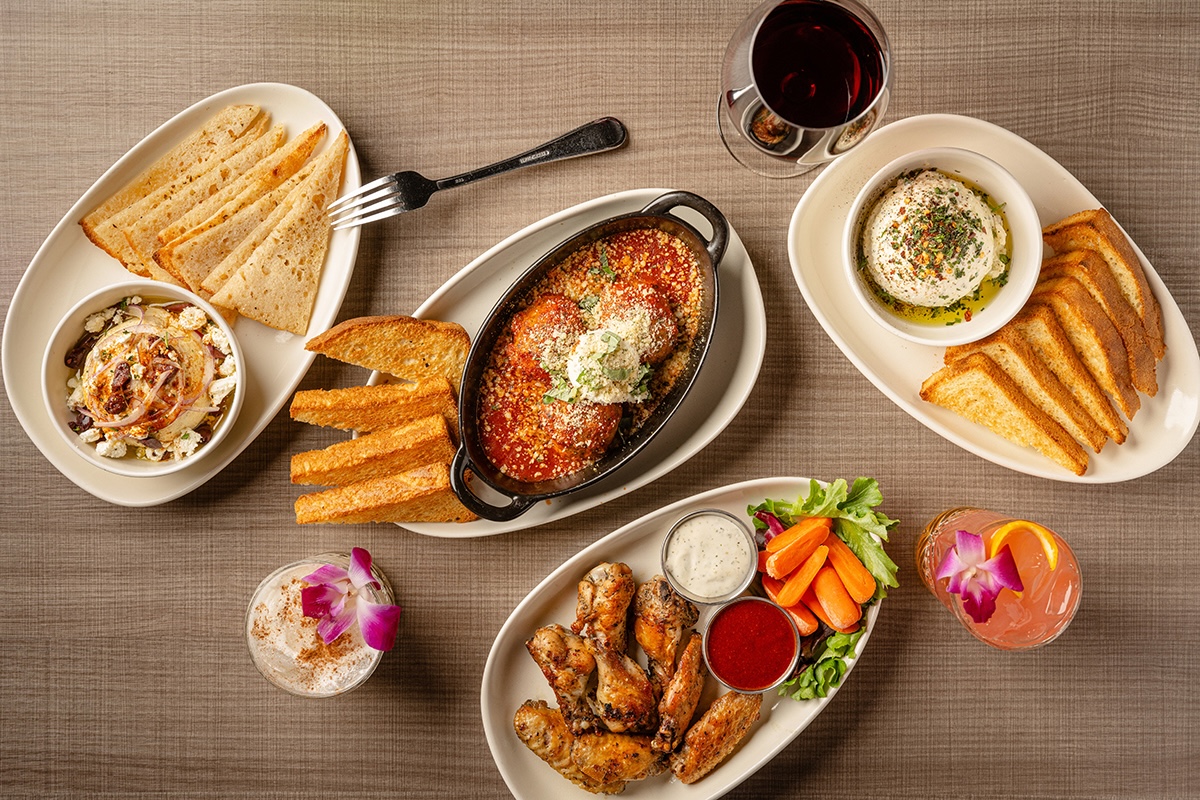 PHX_Picazzos__Jill McNamara Photography - DiningOut Picazzo’s offers plenty of dishes meant for sharing with friends, including the Hummus, Mama’s Meat-za Balls, Whipped Herb Ricotta with Focaccia, and Baked Wings. | Photo by Jill McNamara Photography, courtesy of Picazzo’s