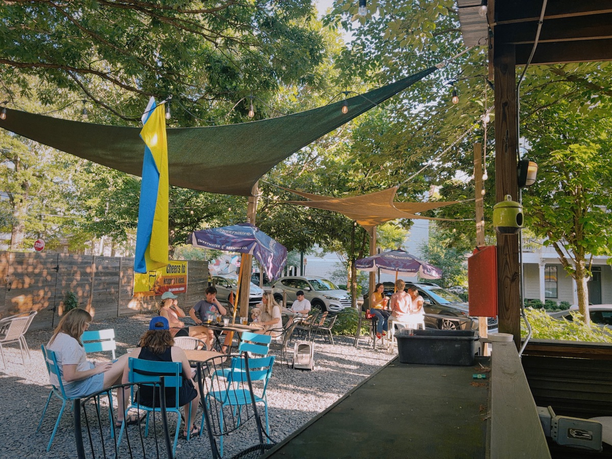 Parkgrounds Patio - DiningOut The shaded patio at Parkgrounds Cafe welcomes dogs and their owners for coffee, sandwiches, beer, and neighborhood hangouts throughout the day. | Photo by Parkgrounds Cafe