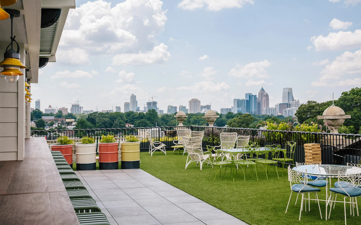 The rooftop at Hotel Clermont offers sweeping views of the Atlanta skyline, along with a relaxed setting that has made it a favorite for drinks and sunset watching. | Photo by Hotel Clermont