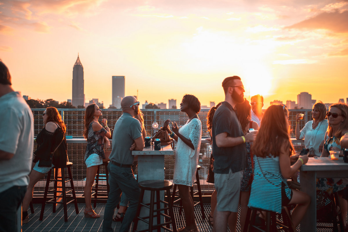 Visitors enjoy sunset cocktails and skyline views at the Roof at Ponce City Market, home to Skyline Park, 9 Mile Station, and 12 Cocktail Bar. | Photo by Ponce City Market