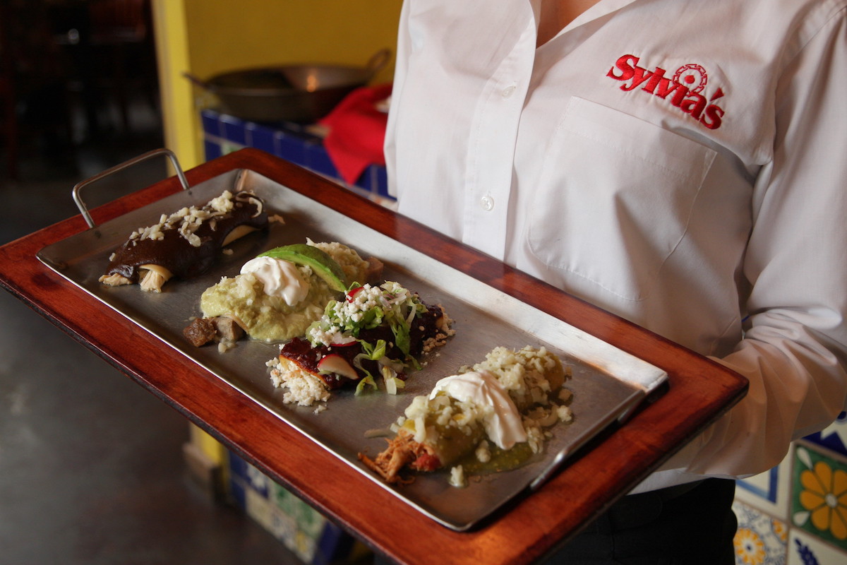 The South of the Border platter at Sylvia's Enchilada Kitchen, a four-piece sampler showcasing Mexican favorites. | Photo by Sylvia's Enchilada Kitchen