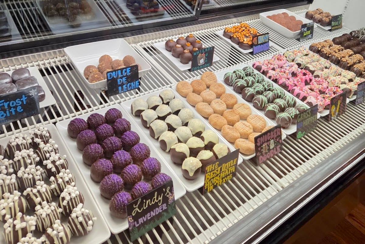 Handcrafted truffles and bonbons fill the display case at Tejas Chocolate + Barbecue. | Photo by Tejas Chocolate + Barbecue