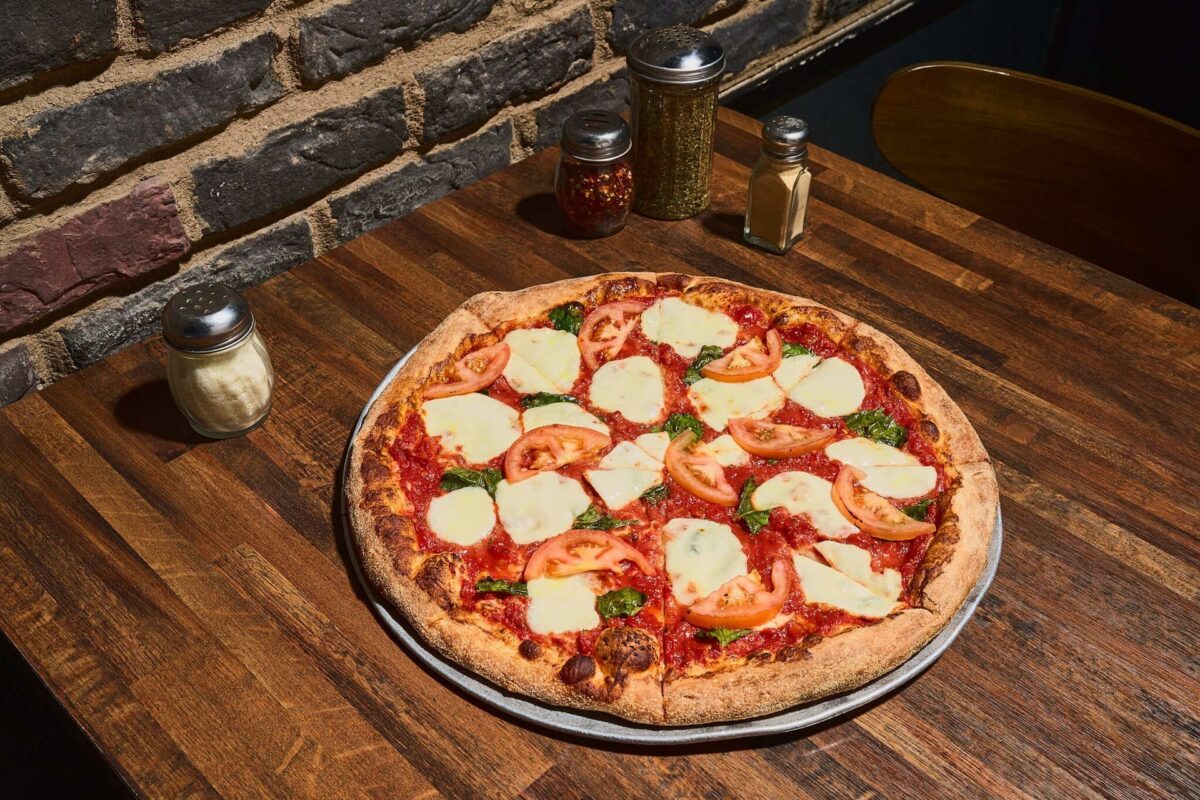 The Margherita Pizza with added fresh tomatoes is a popular choice. | Photo courtesy of Venezia’s Pizzeria