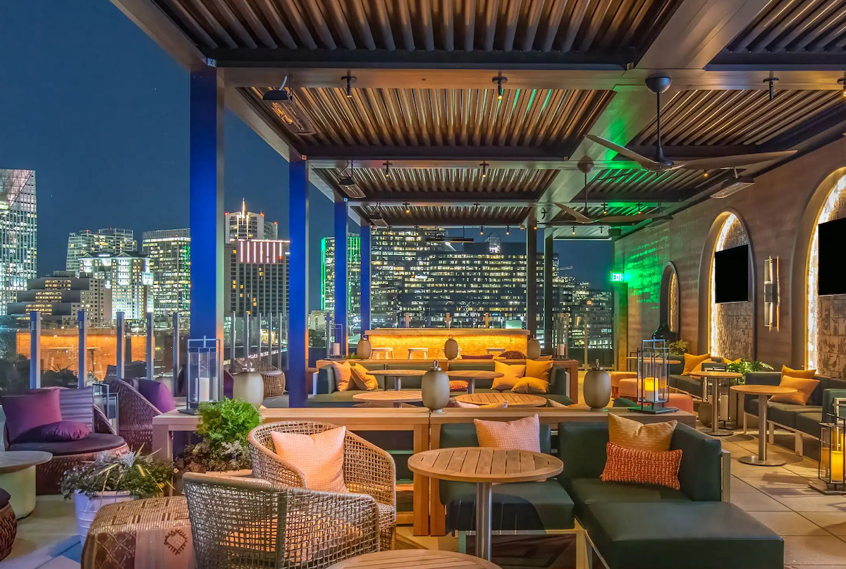 Spaceman Lounge, perched atop the Hyatt Centric Buckhead Atlanta, pairs panoramic city views with craft cocktails and a vibrant rooftop atmosphere after dark. | Photo by Hyatt Hotels