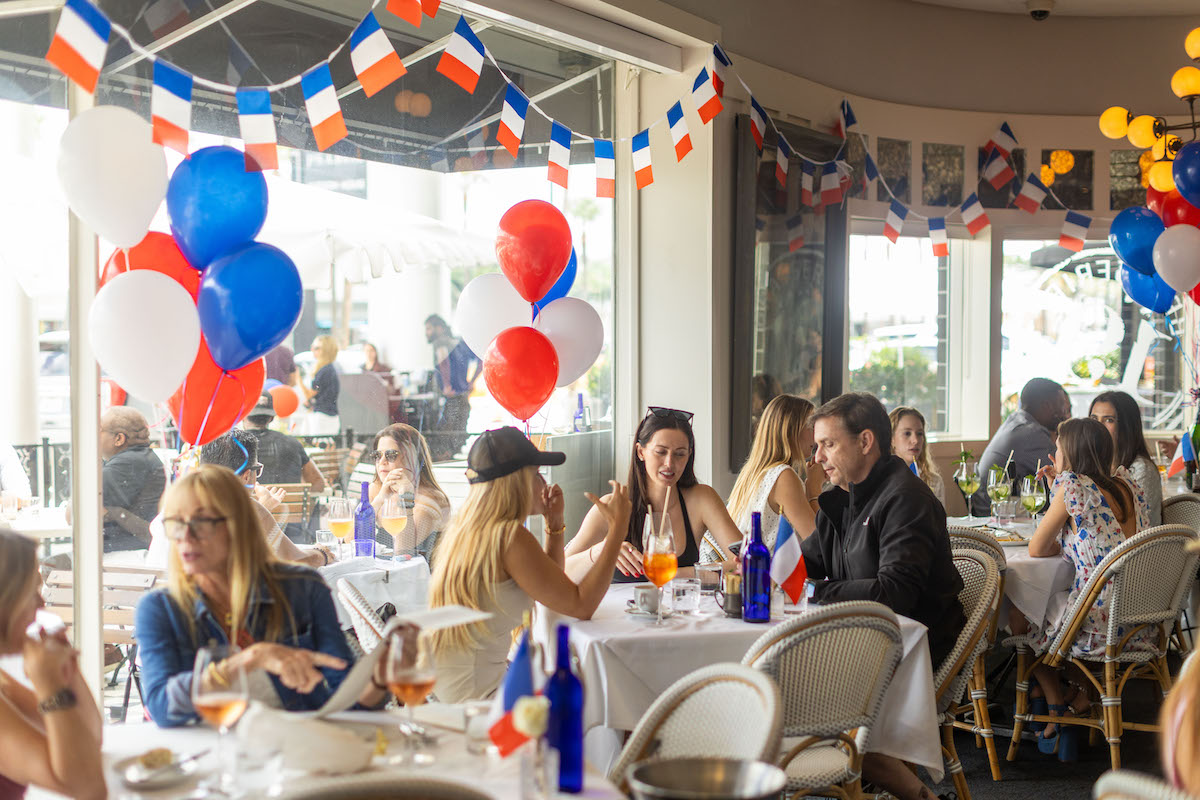 Red, white, and blue balloons and French flags transform Brasserie 19 into a festive destination for one of Houston's most beloved Bastille Day celebrations. | Photo by Andrew Hemingway