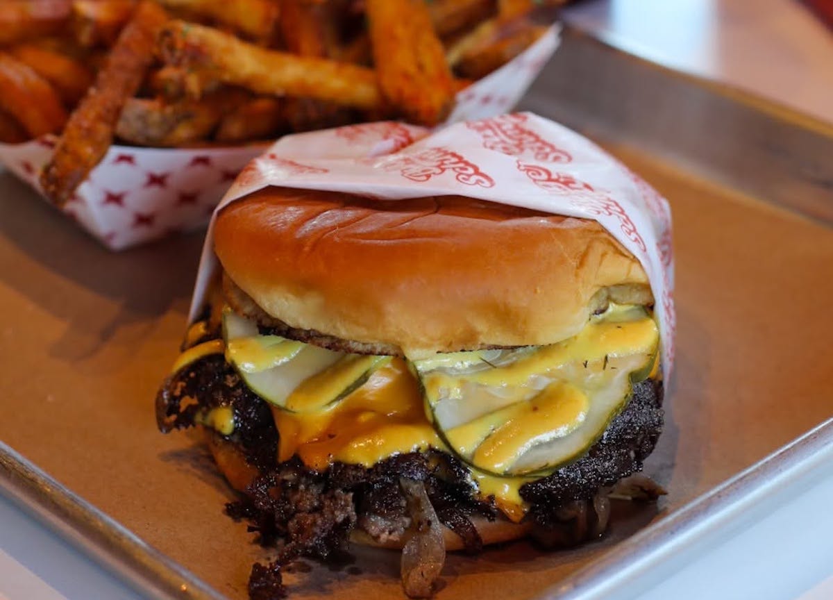 A smashburger and hand punched fries at Burger Schmurger, one of the list's top contenders. | Photo by Burger Schmurger