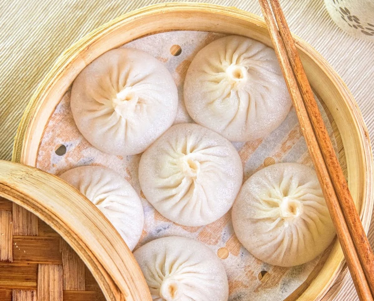 Canton Kitchen - DiningOut Canton Kitchen's xiao long bao arrive steaming hot, each delicate soup dumpling carefully pleated and filled with rich broth and savory pork. | Photo by Canton Kitchen