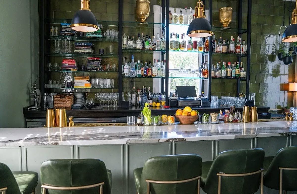 The elegant bar at Common Thread welcomes guests to a James Beard-recognized restaurant known for seasonal Lowcountry ingredients and global flavors. | Photo by Common Thread