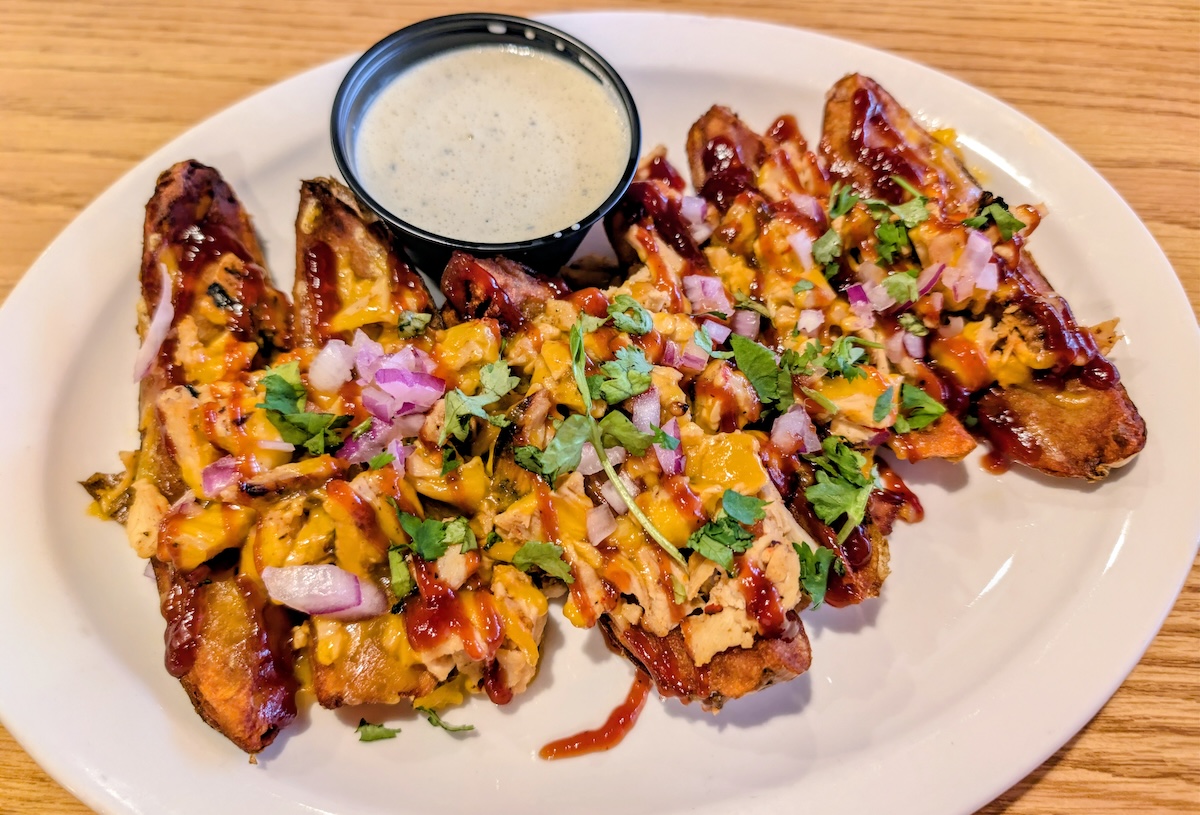 DEN_Mickeys_Top_Sirloin_Chicken_Skins_by_Linnea_Covington - DiningOut The chicken-stuffed potato skins are a staff favorite off the appetizer menu. | Photo by Linnea Covington