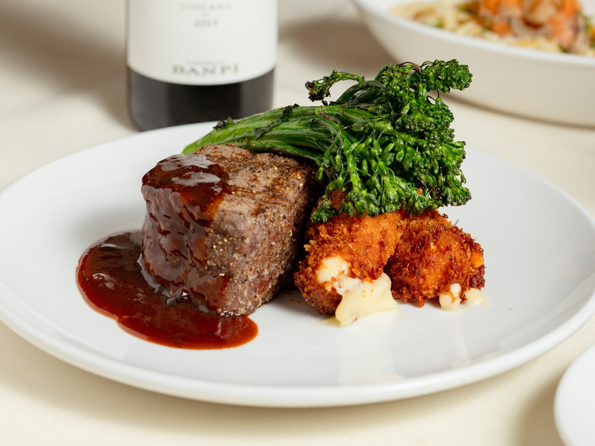 Marvino's Italian Steakhouse will serve wood-grilled filet mignon with charred romesco, crispy Parmesan polenta, and broccolini during its one-night-only Italian Wine Dinner on July 30. | Photo by Grupo Herrera Restaurants