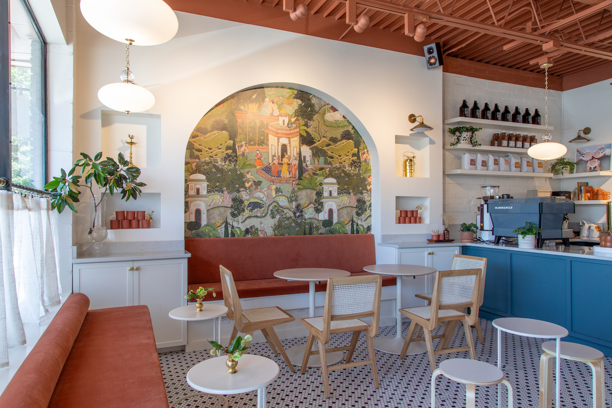 Inspired by Indian tea stalls, the Chai Box Cafe features a bright, inviting dining room anchored by a mural reminiscent of traditional Rajasthani miniature paintings. | Photo by Kate Blohm