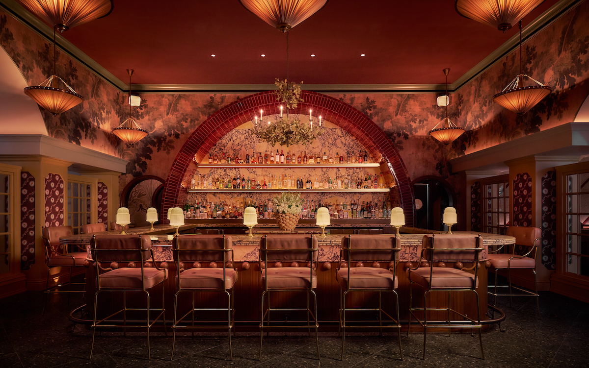 The dramatic central bar at Scilla anchors the restaurant with handcrafted cocktails, marble finishes, and romantic Mediterranean-inspired interiors. | Photo by Stephen Karlisch