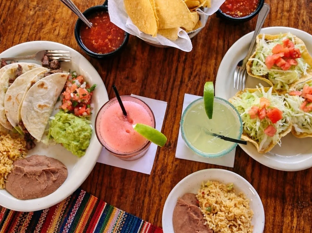 A spread of tacos, chips and salsa, and frozen margaritas showcases the dishes that have made Lopez Mexican Restaurant a Houston institution for generations. | Photo by Lopez Mexican Restaurant