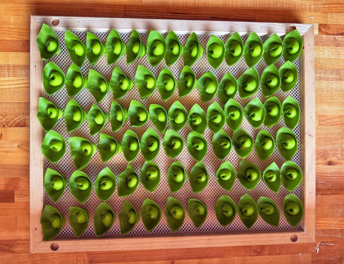 Handmade stinging nettle cappelletti showcases the artistry behind Lucia Pasta Bar's celebrated fresh pasta program. | Photo by Lucia Pasta Bar
