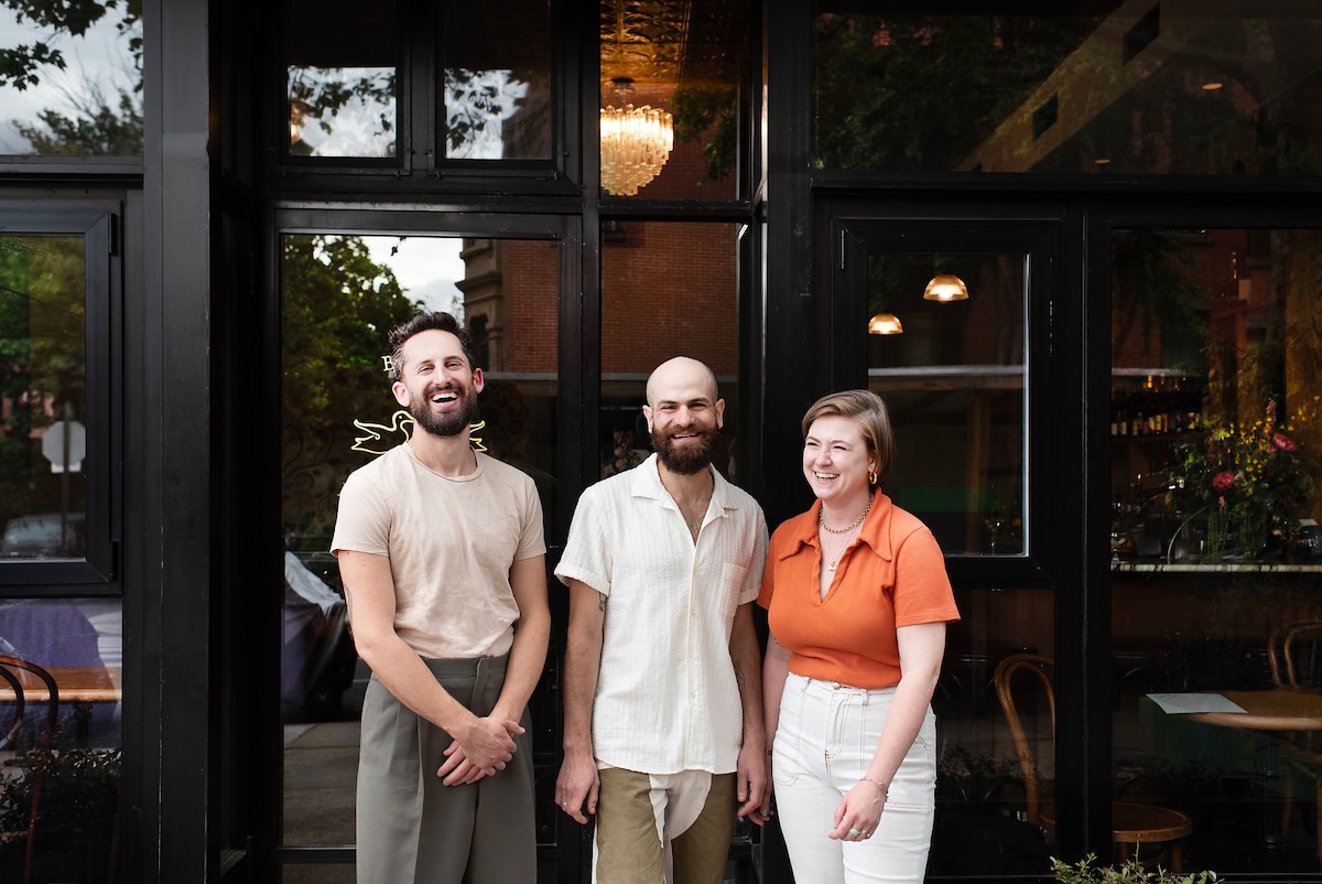 Chef Eli Sussman (left) with staff at Gertrude's in Brooklyn. | Photo by Liz Clayman
