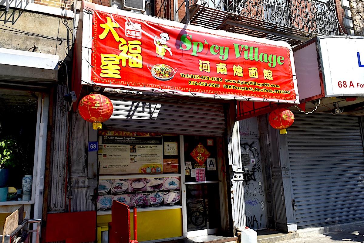 Big tray chicken and pork-stuffed pancakes are favorites at Spicy Village. | Photo by Paul Kim