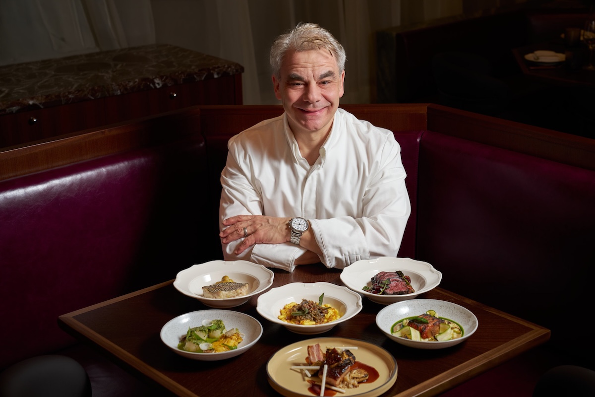 Chef Gabriel Kreuther sits among some of his creations. | Photo courtesy of Saverne