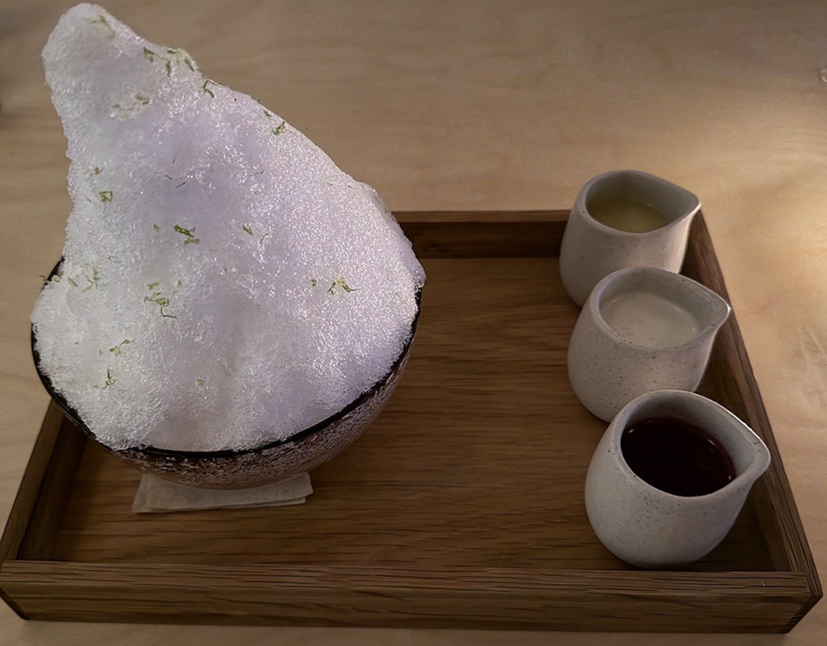 The Kakigori, topped with shaved ice and served with prickly pear, pineapple, and coconut creams, is one of Neighborhood Sushi's standout desserts. | Photo by Desiree Gutierrez