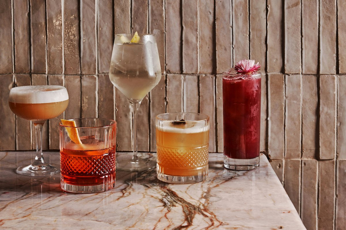 Osteria Olio - DiningOut A lineup of handcrafted cocktails showcases Osteria Olio's creative mixology. | Photo by Rivet House