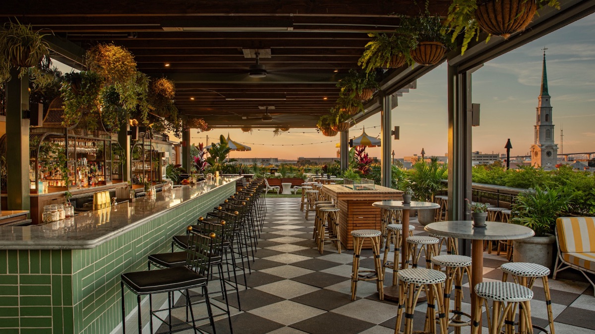Peregrin Rooftop Bar offers sweeping views of Savannah's skyline alongside botanical cocktails and elevated bar bites. | Photo by Perry Lane Hotel