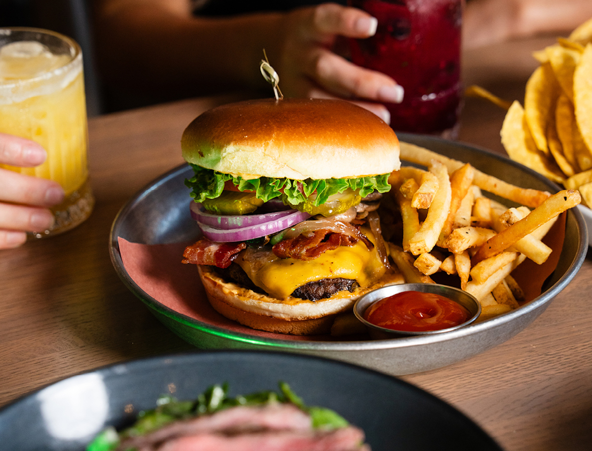 The towering Shark Burger at Shark Club. | Photo by Shark Club
