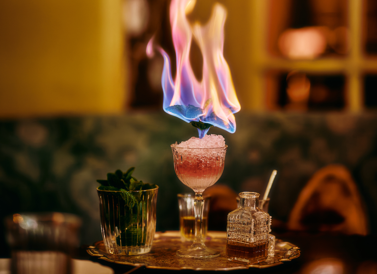 The Sicilian shaved ice arrives with a dramatic tableside flame presentation, adding a touch of theater to the aperitivo experience. | Photo by Chase Hall
