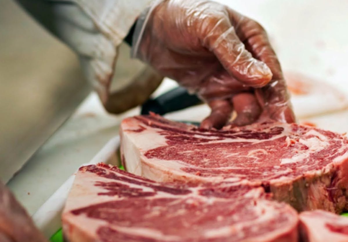 Stripling's - DiningOut A well-marbled bone-in ribeye is expertly trimmed at Stripling's General Store, where old-school butchery has been a family tradition since 1964. | Photo by Stripling's