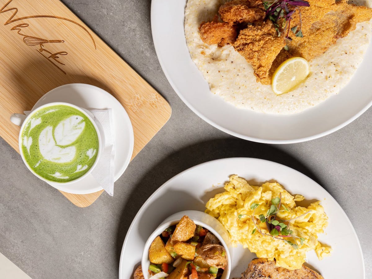 Southern breakfast favorites at Whisk, including creamy shrimp and grits, scrambled eggs, breakfast potatoes, and a matcha latte. | Photo by Whisk