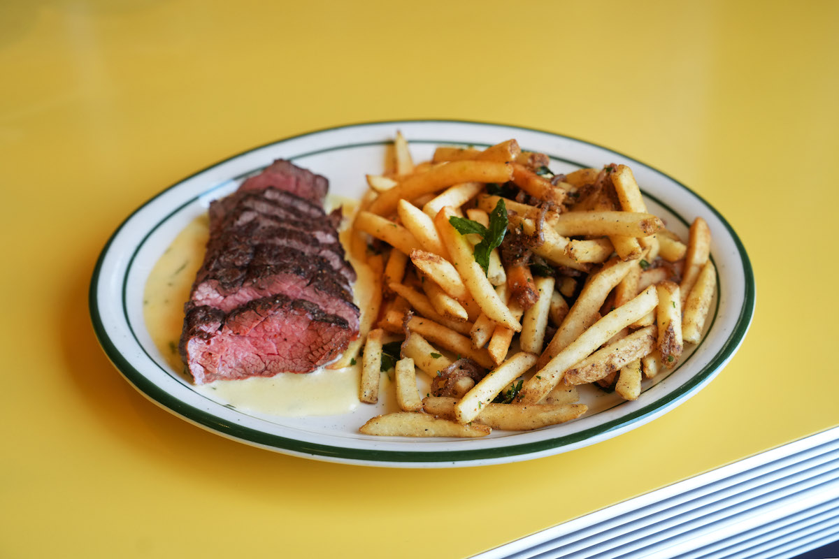 Agnes and Sherman puts an Asian-inspired spin on steak frites, pairing sliced bavette steak with a generous pile of crispy, seasoned fries. | Photo by Vivian Leba